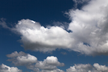 Blue sky background with a white clouds.