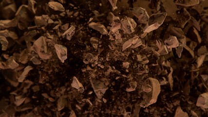 Aufkleber - Freeze motion of flying group of raw chocolate pieces.