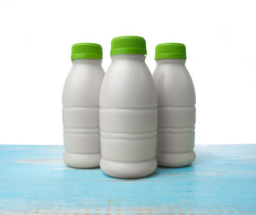 Sticker - Bottle of milk on wood isolated on white background