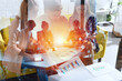 © alphaspirit - Business people that work together in office with statistics. Concept of teamwork and partnership