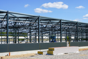 construction of a new modern industrial building, metal truss frame