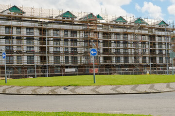 Wall Mural - Scaffolding surrounding house development for safe access to construction work