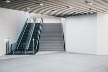 Modern train station interior with escalator