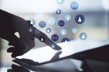 Aufkleber - Hand using digital tablet with glowing email network symbol.