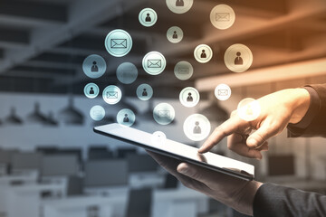 Aufkleber - Hand using digital tablet with glowing social media symbol.
