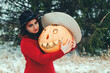 a witch and a large Halloween carved pumpkin