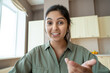 © insta_photos - Young indian woman speaking to webcam during conference video call working at home office. Distance teacher or tutor teaching online, giving workshop webinar. Videocall screenshot closeup headshot.