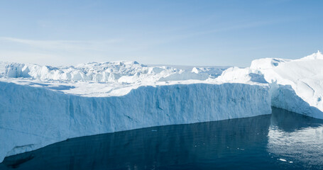 Wall Mural - global warming and climate change concept. icebergs from melting glacier in icefjord - icefjord in i