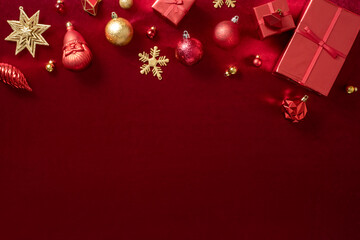 Aufkleber - red christmas decoration bauble and ribbon on velvet red felt fabric  top view table background