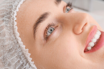 Canvas Print - Woman undergoing cosmetic procedure in beauty salon, closeup