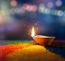 Happy Diwali, Lit Diya Lamp On An Abstract Background With Shallow Depth Of Field