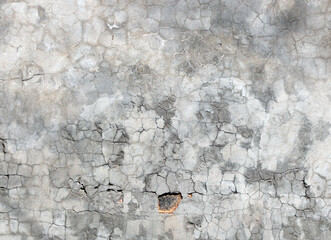 Texture of old wall with cracked stucco of gray color