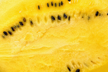 Closeup of fresh yellow watermelon slices on plate