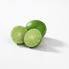 Closeup Of Small Green Key Limes Isolated On A White Background