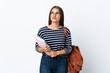 © luismolinero - Young student woman isolated on white background looking up while smiling