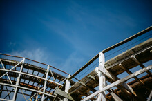 Low Angle View Of Wooden Structure Against Blue Sky
