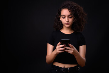 Portrait of young beautiful Persian teenage girl with curly hair