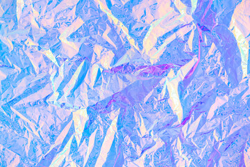 Blurred abstract Modern pastel colored holographic background in 80s style. Crumpled iridescent foil real texture. Synthwave. Vaporwave style. Retrowave, retro futurism, webpunk