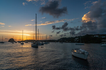 Wall Mural -  Saint Vincent and the Grenadines, sailboats mooring in Blue Lagoon and sunset