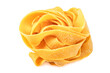 Classic uncooked  tagliatelle or papardelle pasta isolated on a white background