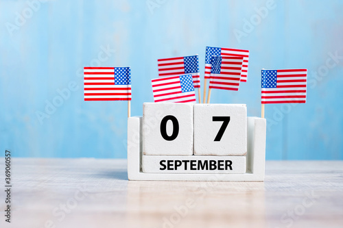 7 September of white Calendar with United States of America flag on wood background. copy space for text. Happy Labor day 2020 and Holiday concept