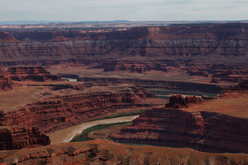 Dramatic view of Canyonlands National Park in southeastern Utah with Colorado River running through it
