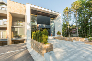 Entrance to a mountain hotel in the summer