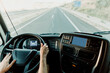© Javier Pardina/Stocksy - Scene of a truck driver driving on the road.
