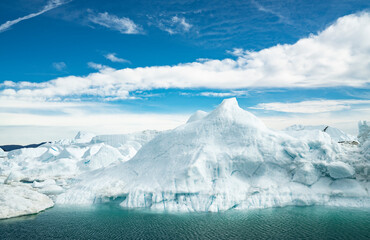 Wall Mural - climate change. iceberg afrom glacier in arctic nature landscape on greenland. icebergs in ilulissat