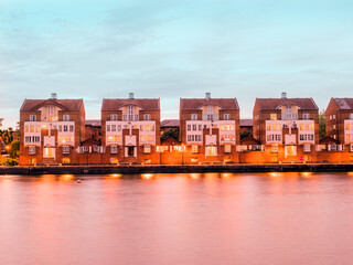 Wall Mural - Traditional old house architecture on the riverside of the Thames river in the South area of London 