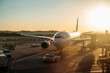 © David Prado/Stocksy - Airport terminal building with planes