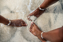 Women Barefoot In A Sandy Beach