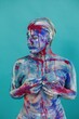 © Liliya Rodnikova/Stocksy - Blue and pink body art on turquoise background