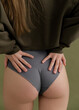© Sibstock/Stocksy - attractive female ass, minimalistic photo with hands