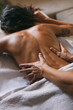 © VeaVea/Stocksy - Masseur doing massage of female back indoor