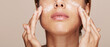 © Leandro Crespi Studio/Stocksy - Woman portrait applying cream or moisturiser isolated