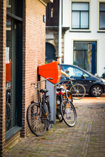 Leiden, Netherlands, 31 July 2020: Image Of The Orange Mailbox Owned By The Post NL, Holland Post Service