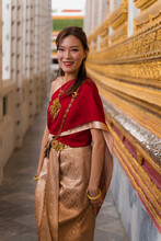 Asian Woman Visiting A Temple In Thailand