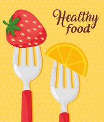 Wall Mural - healthy food, strawberry with sliced orange in forks