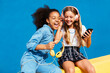 © BONNINSTUDIO/Stocksy - Excited girls listening to music together