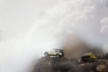Group Of 4wd Off Road Cars On The Top Of Montain.Travel And Racing Concept For Four Wheel Drive And Off Road  Vehicle .