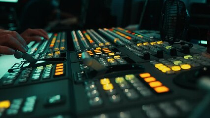 Wall Mural - Broadcast Tv Studio Production - Vision Switcher Studio Director broadcast video mixer operation - Close-up of hand. Hands of a cinematographer who worked on the vision mixer, switch the TV panel.