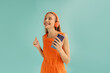 © Sergey Filimonov/Stocksy - Happy female listening to music