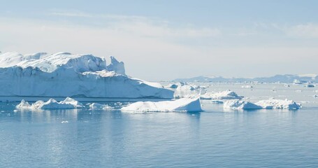 Wall Mural - global warming and climate change - icebergs melting glacier in icefjord in ilulissat, greenland. vi