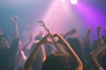 Party with friends dancing in the club. asian event holidays celebrate nightlife. Group of young girl happy dancing party hand holding a drink.  Lady with shape heart in event concert