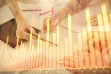 Poster - Double exposure of forex graph drawing and man and woman working together holding and using a mobile device. Trade concept.