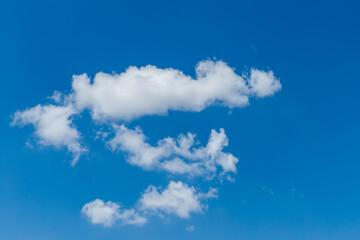 Wall Mural - white, fluffy clouds in blue sky. background from clouds