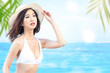 © Leo Lintang - Asian woman with bikini and hat relaxing