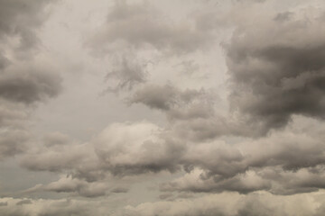 Background of dark and gray clouds in the sky before rain.