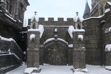 Wall Mural - Gate in Garibaldi Castle in village near Togliatti city, Samara region, Russia. Beautiful architecture in medieval gothic style. Togliatti landmark, monument, view, sight. Garibaldi Castle in winter